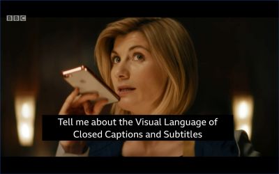 A picture of a woman with mobile saying ‘Tell me about the Visual Language of Closed Captions and Subtitles’